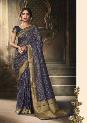 Here Is A Royal Looking Rich Designer Saree In Navy Blue Color. This Saree And Blouse Are Fabricated On Banarasi Art Silk Beautified With Detailed Weave. Its Rich Fabric And Color Gives An elegant Look And Will Definitely Earn You Lots Of Compliments From Onlookers. 