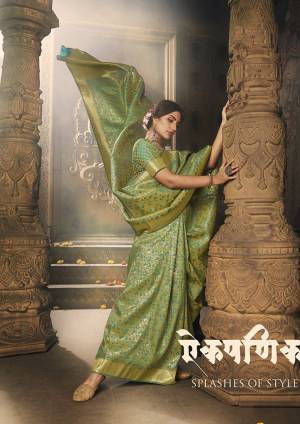 Here Is A Royal Looking Rich Designer Saree In Green Color. This Saree And Blouse Are Fabricated On Banarasi Art Silk Beautified With Detailed Weave. Its Rich Fabric And Color Gives An elegant Look And Will Definitely Earn You Lots Of Compliments From Onlookers. 