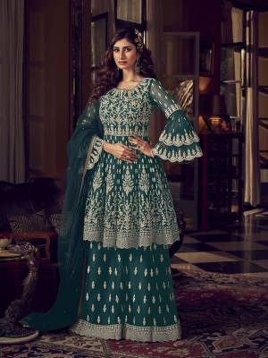 Look Pretty In This Heavy Designer Shararar Suit In Teal Blue Color. Its Beautiful Top, Bottom and Dupatta Are Fabricated On Net Beautified With Heavy Detailed Embroidery. Its Pretty Color And Embroidery Will Earn You Lots Of compliments From Onlookers. 