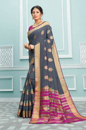 Here Is A Pretty Designer Saree In Grey Color Paired With Magenta Pink Colored Blouse. This Saree And Blouse Are Fabricated On Cotton Beautified With Weaved Motifs And Broad Border. 
