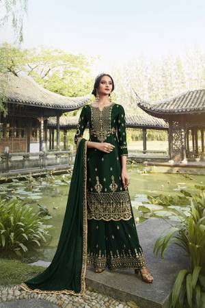 Enhance Your Personality Wearing This Heavy Designer Straight suit In Dark Green Color. It Pretty Embroidered Top, Bottom and Dupatta Are Fabricated On Georgette Which Is Light In Weight And Easy To Carry Throughout The Gala. 