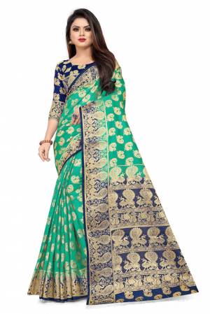 For A Proper Traditional Look, Grab This Heavy Weaved Silk Based Designer Saree In Sea Green Color Paired with Navy Blue Colored blouse. This Saree and Blouse Are Fabricated On Art Silk Which Gives A Rich Look To Your Personality. 