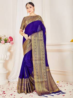 Flaunt Your Rich and Elegant Taste Wearing This Designer Silk Based Saree In Royal Blue Color Paired With Golden Colored Blouse. This Saree And Blouse Are Fabricated On Banarasi Art Silk Beautified With Weaved Broad Border. 