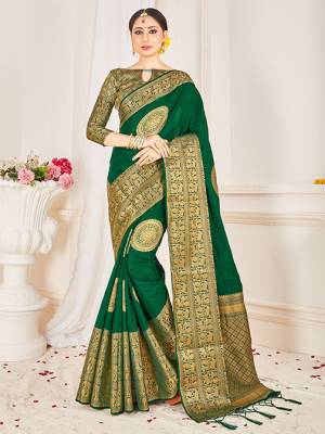 Flaunt Your Rich and Elegant Taste Wearing This Designer Silk Based Saree In Dark Green Color Paired With Dark Green Colored Blouse. This Saree And Blouse Are Fabricated On Banarasi Art Silk Beautified With Weaved Broad Border. 