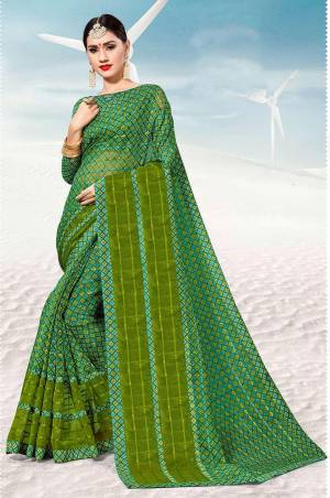 Pretty Simple Saree For Your Casual Or Semi-Casual Wear Is Here In Green Color. This Saree And Blouse Are Fabricated On Kota Silk Beautified With Prints All Over. 