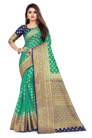 For A Proper Traditional Look, Grab This Heavy Weaved Silk Based Designer Saree In Sea Green Color Paired with Navy Blue Colored blouse. This Saree and Blouse Are Fabricated On Art Silk Which Gives A Rich Look To Your Personality. 